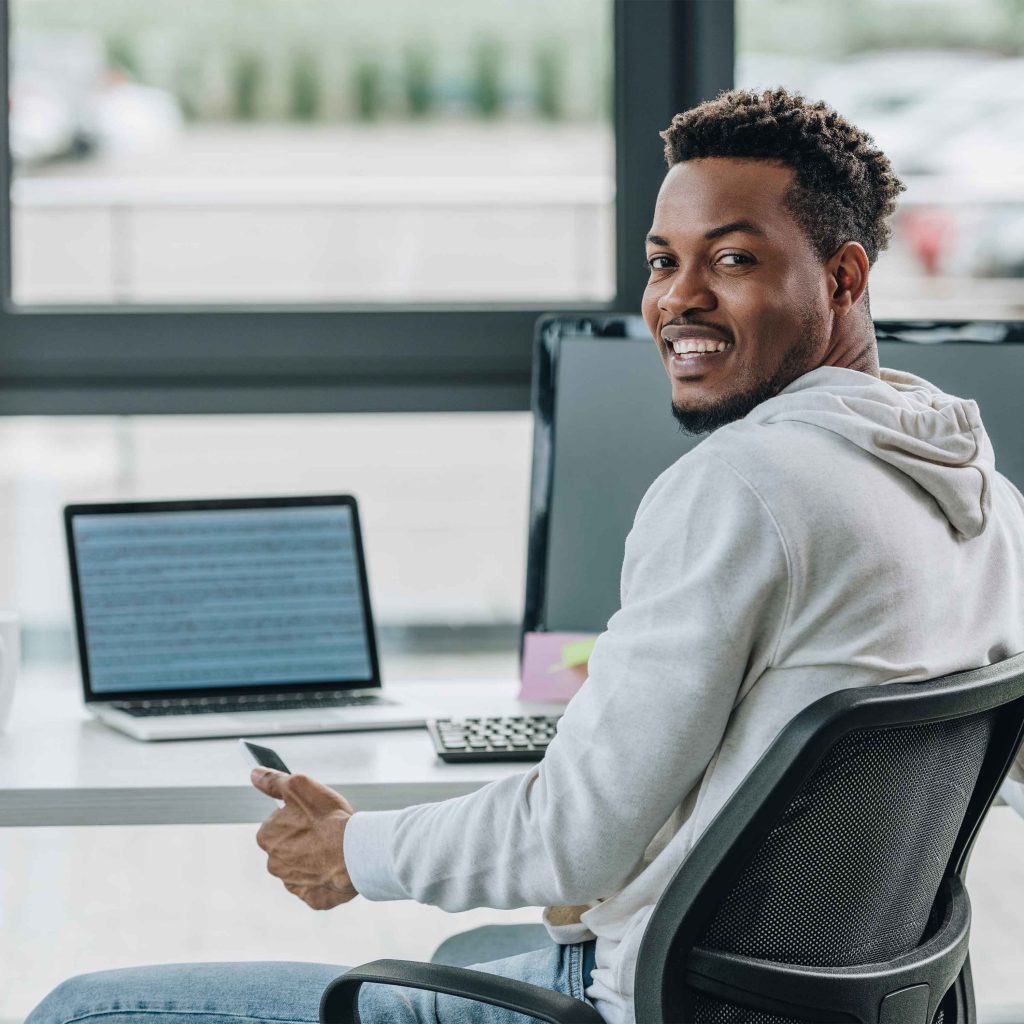photo of a man taking an online course at a laptop